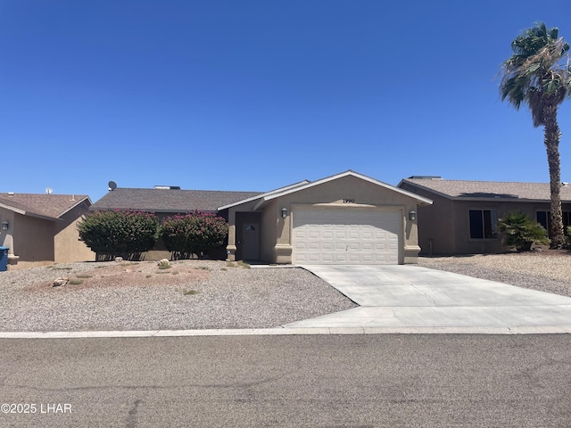 1990 Folzman Dr, Lake Havasu City, AZ 86404 - single story home with a garage, concrete driveway, and stucco siding