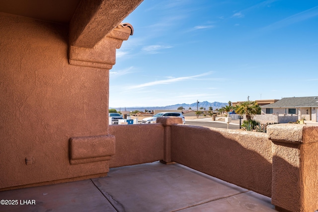 balcony with a residential view and a mountain view