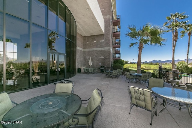 view of patio / terrace featuring a grill and a mountain view