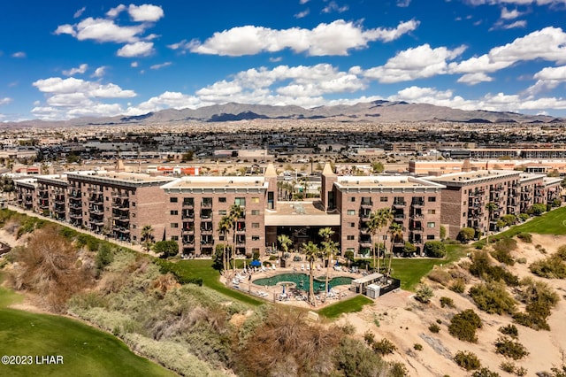 birds eye view of property with a mountain view