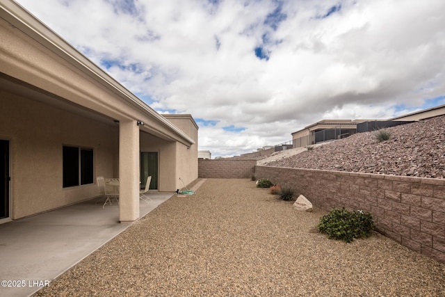 view of yard featuring a patio and a fenced backyard