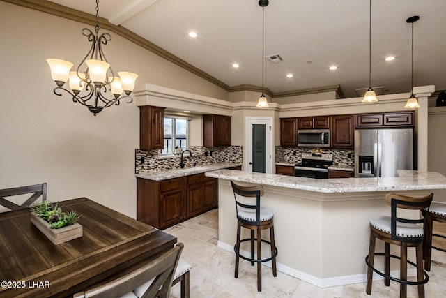 kitchen with stainless steel appliances, dark brown cabinetry, visible vents, and a breakfast bar area