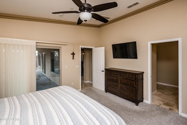 bedroom featuring access to exterior, visible vents, crown molding, baseboards, and carpet floors