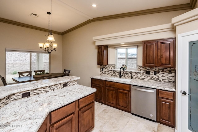 kitchen featuring visible vents, a sink, tasteful backsplash, stainless steel dishwasher, and an inviting chandelier