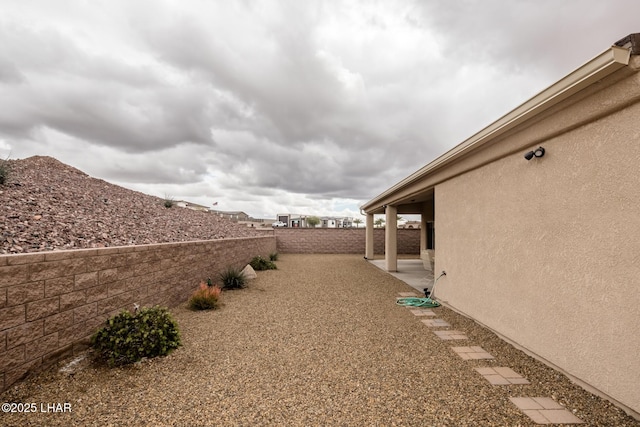 view of yard featuring a patio and a fenced backyard