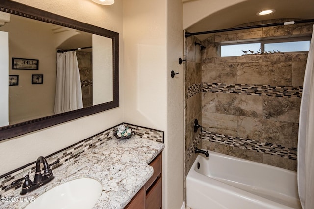 bathroom featuring vanity and shower / bath combo with shower curtain