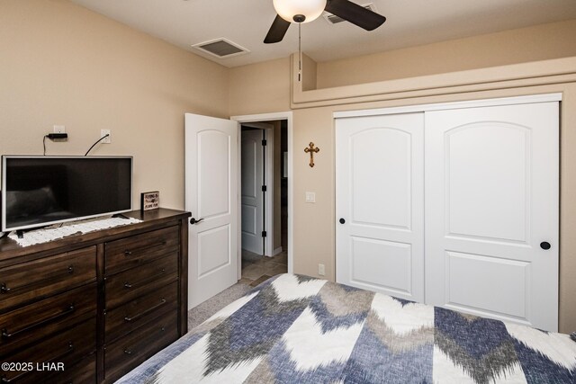 bedroom featuring visible vents, a closet, and ceiling fan