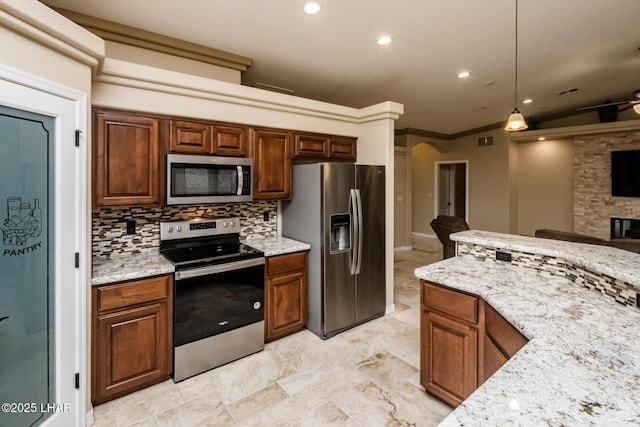 kitchen with light stone counters, open floor plan, backsplash, and appliances with stainless steel finishes