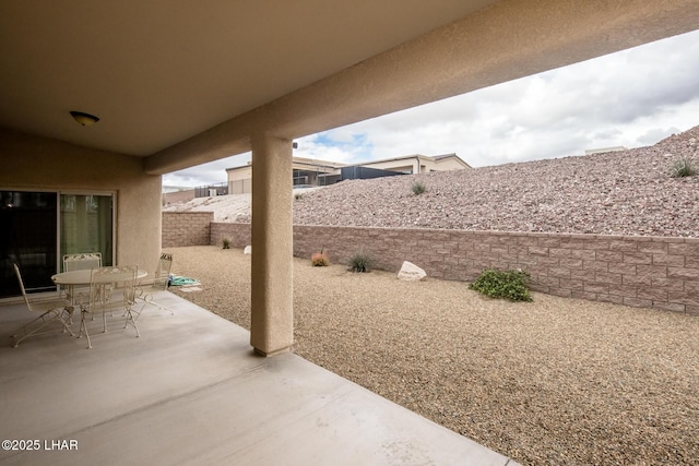 view of patio with outdoor dining area and a fenced backyard