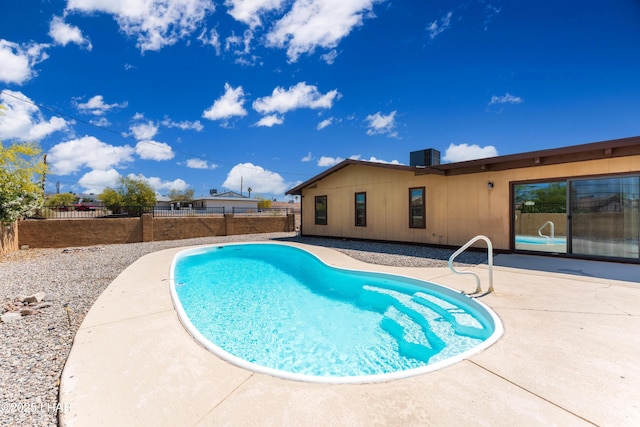 view of pool featuring a patio and a fenced backyard