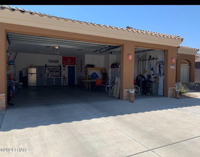 garage featuring stainless steel fridge