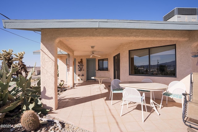 view of patio / terrace featuring central air condition unit, ceiling fan, and outdoor dining space