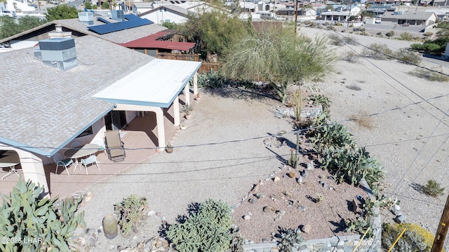 birds eye view of property with a residential view