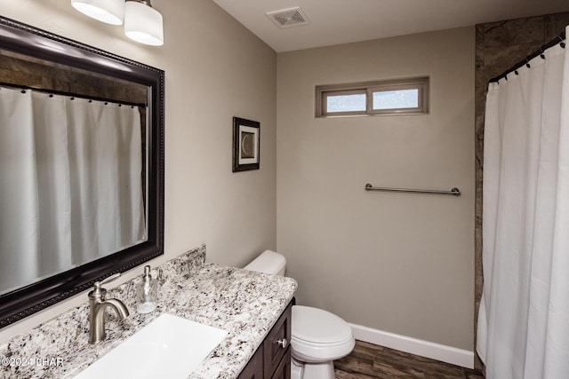 bathroom with a shower with curtain, vanity, toilet, and wood-type flooring