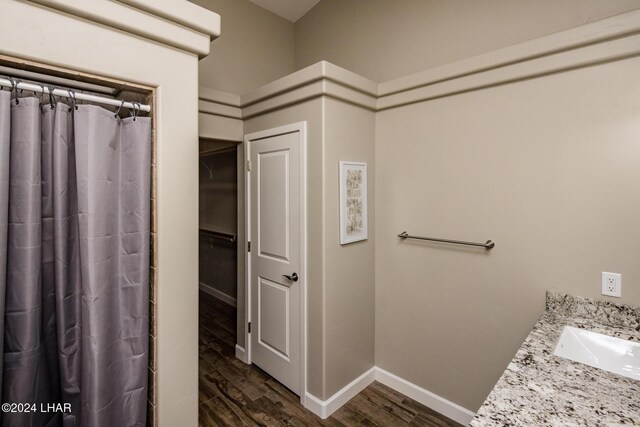 bathroom with vanity, hardwood / wood-style floors, and a shower with curtain