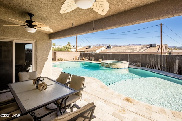 view of pool featuring an in ground hot tub, ceiling fan, and a patio