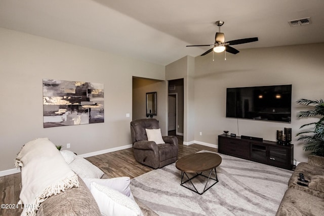 living room featuring hardwood / wood-style flooring and ceiling fan