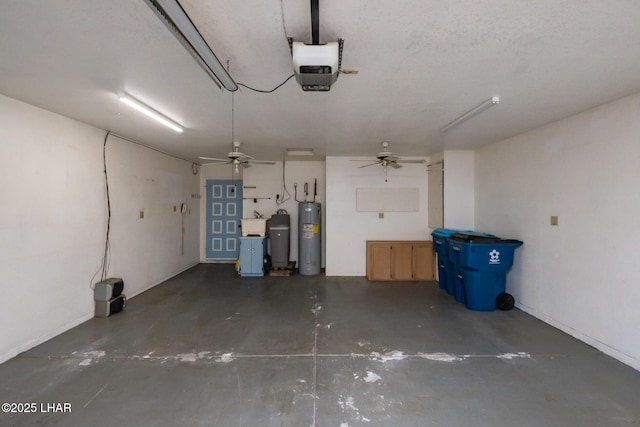 3716 Sloop Ln, Lake Havasu City, AZ 86406 - garage featuring electric water heater, a garage door opener, a ceiling fan, and a sink