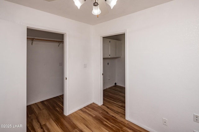3716 Sloop Ln, Lake Havasu City, AZ 86406 - unfurnished bedroom with wood finished floors, baseboards, a closet, and a ceiling fan
