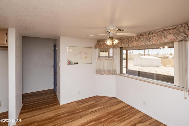 3716 Sloop Ln, Lake Havasu City, AZ 86406 - unfurnished dining area featuring light wood finished floors, ceiling fan, and baseboards