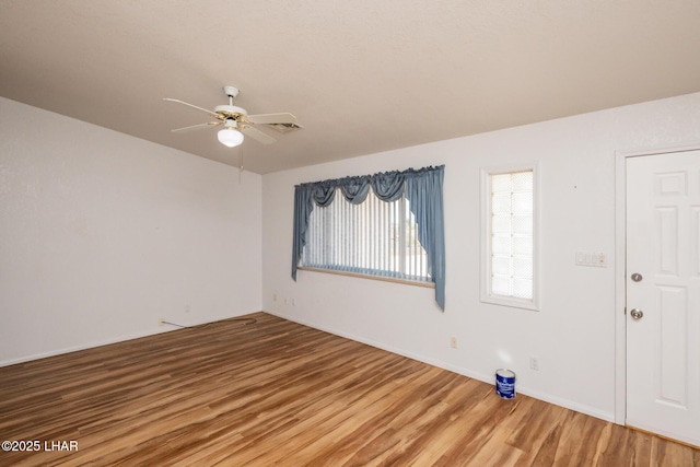 3716 Sloop Ln, Lake Havasu City, AZ 86406 - empty room with wood finished floors, ceiling fan, and baseboards