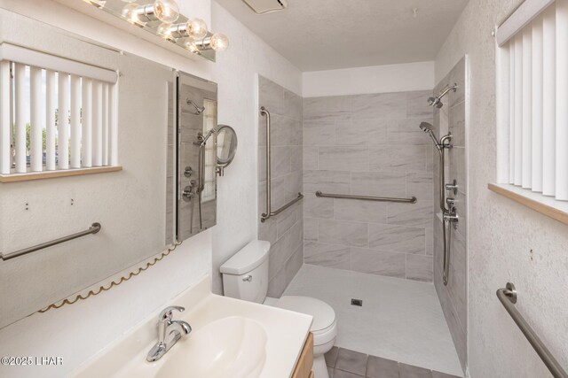 3716 Sloop Ln, Lake Havasu City, AZ 86406 - full bathroom with toilet, a tile shower, vanity, and tile patterned floors