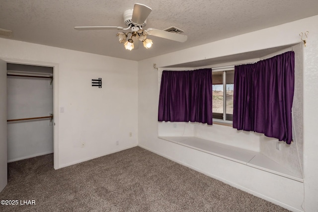 3716 Sloop Ln, Lake Havasu City, AZ 86406 - unfurnished bedroom featuring carpet, a textured ceiling, baseboards, a closet, and ceiling fan