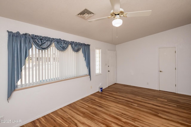 3716 Sloop Ln, Lake Havasu City, AZ 86406 - unfurnished room featuring wood finished floors, a ceiling fan, and baseboards