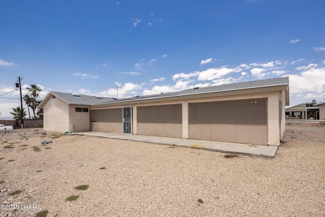 3716 Sloop Ln, Lake Havasu City, AZ 86406 - rear view of property with an attached garage and stucco siding