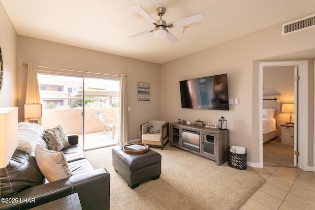 1650 Smoketree Ave S Unit 119, Lake Havasu City, AZ 86403 - living room featuring visible vents, light tile patterned flooring, light carpet, baseboards, and a ceiling fan