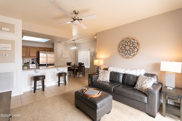 1650 Smoketree Ave S Unit 119, Lake Havasu City, AZ 86403 - living room with ceiling fan, light tile patterned flooring, and a skylight