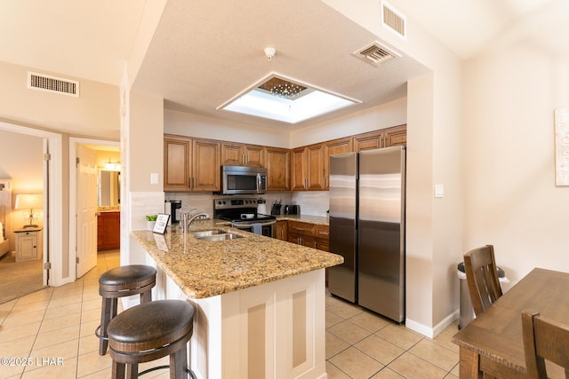 1650 Smoketree Ave S Unit 119, Lake Havasu City, AZ 86403 - kitchen featuring visible vents, appliances with stainless steel finishes, and light tile patterned floors