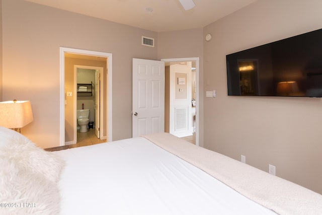1650 Smoketree Ave S Unit 119, Lake Havasu City, AZ 86403 - bedroom featuring a ceiling fan, visible vents, tile patterned flooring, baseboards, and ensuite bath
