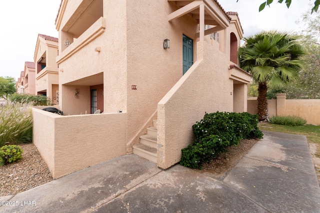 1650 Smoketree Ave S Unit 119, Lake Havasu City, AZ 86403 - view of side of home featuring stucco siding and fence