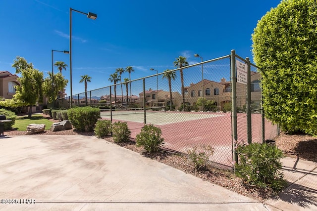 1650 Smoketree Ave S Unit 119, Lake Havasu City, AZ 86403 - view of tennis court with fence and a residential view