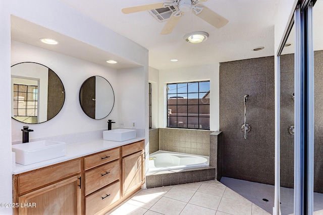 bathroom with tile patterned flooring, vanity, independent shower and bath, and ceiling fan