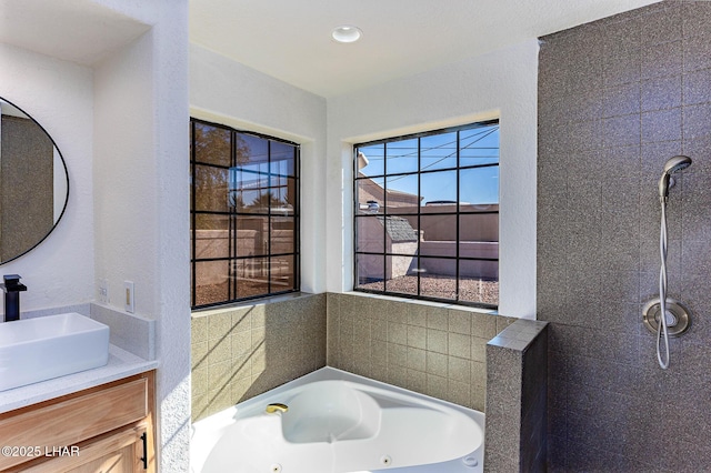 bathroom with vanity and a bathing tub