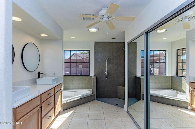 bathroom featuring ceiling fan, vanity, separate shower and tub, and tile patterned flooring