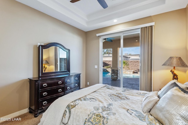 1589 Park Terrace Ave, Lake Havasu City, AZ 86404 - bedroom featuring access to exterior, a raised ceiling, a ceiling fan, carpet flooring, and baseboards