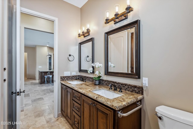 1589 Park Terrace Ave, Lake Havasu City, AZ 86404 - bathroom featuring stone finish flooring, a sink, toilet, and double vanity
