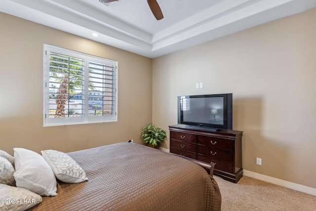 1589 Park Terrace Ave, Lake Havasu City, AZ 86404 - bedroom featuring light carpet, ceiling fan, a tray ceiling, and baseboards