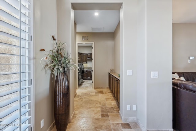 1589 Park Terrace Ave, Lake Havasu City, AZ 86404 - hallway with baseboards, visible vents, and stone tile flooring