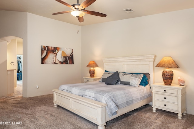 bedroom with ceiling fan and carpet flooring