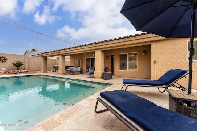 view of swimming pool with a patio