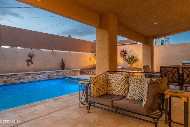 view of swimming pool featuring a patio