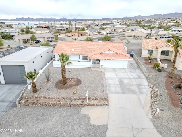 aerial view featuring a mountain view and a residential view