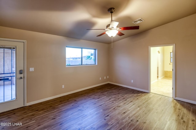 879 Window Rock Plz, Lake Havasu City, AZ 86406 - spare room featuring wood finished floors, a ceiling fan, and vaulted ceiling