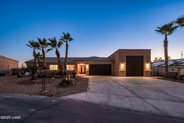 879 Window Rock Plz, Lake Havasu City, AZ 86406 - view of front of home featuring a garage, driveway, and stucco siding