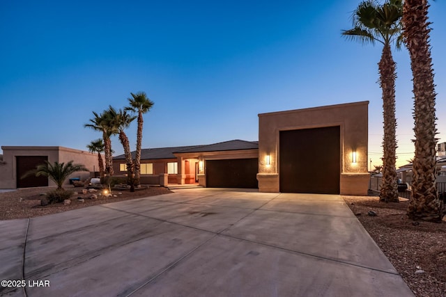 879 Window Rock Plz, Lake Havasu City, AZ 86406 - view of front of home featuring a garage, driveway, and stucco siding