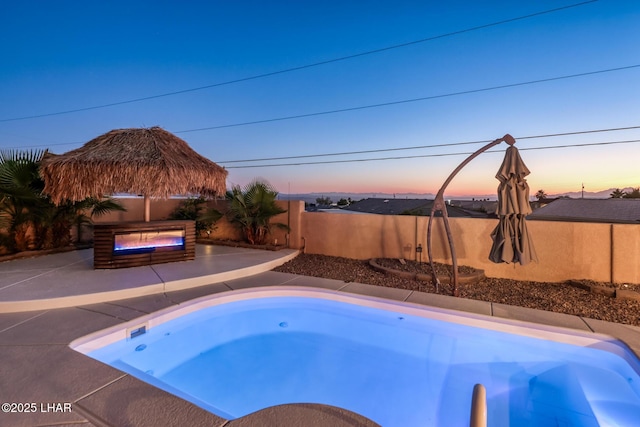 879 Window Rock Plz, Lake Havasu City, AZ 86406 - view of swimming pool featuring a fenced backyard, a patio, and a hot tub